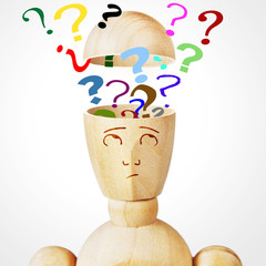 Many question marks into the human head. Abstract image with a wooden puppet