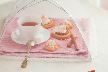 cup of tea with biscuit cakes