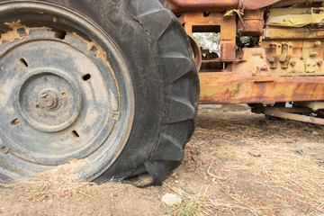Fototapeta na wymiar leak tractor wheel, which is old tire