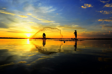 Fototapeta premium Two Fishermen in golden morning light..