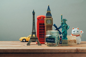 Travel and tourism concept with souvenirs from around the world. Planning summer vacation, money...