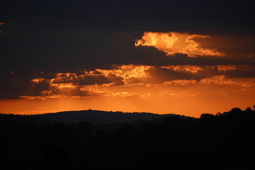 Sunset between dark clouds