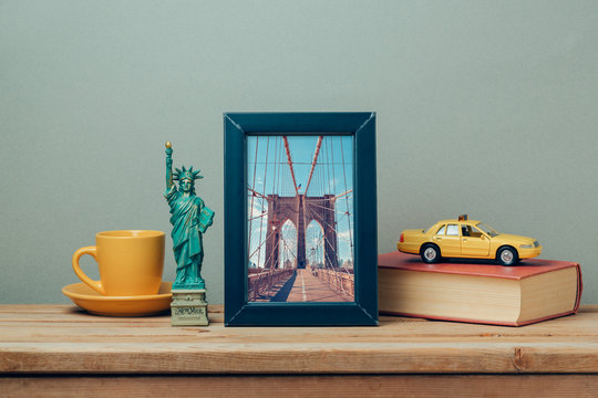 Travel to New York, USA concept with poster mock up template and souvenirs on wooden table