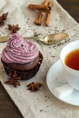mug of blacktea with chocolate cupcakes
