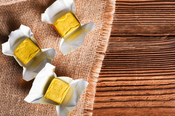 Dehydrated condiment bouillon stock cube salty meat and vegetables aromatic yellow spice,...