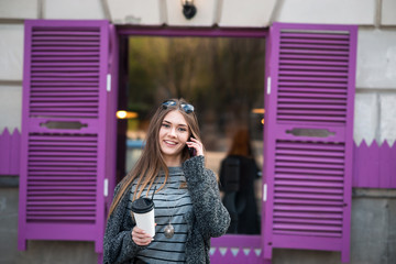 beautiful girl with coffee and tablet