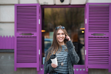 beautiful girl with coffee and tablet