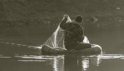 fisherman fishing net on a boat