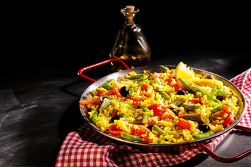 Colorful Vegetarian Spanish Paella Served with Oil