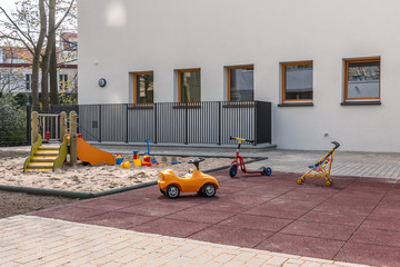 Sandbox with toys in kindergarten on a sunny day