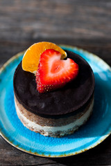 Raw vegan cake with chocolate on top