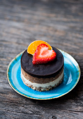 Raw vegan cake with chocolate on top