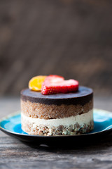 Raw vegan cake with chocolate on top