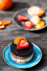 Raw vegan cake with chocolate on top