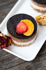 Raw vegan cake with chocolate on top