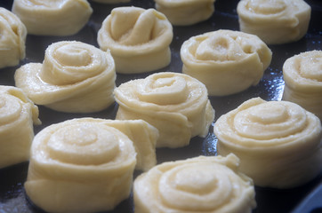 Bun dough on a baking sheet ready for the oven