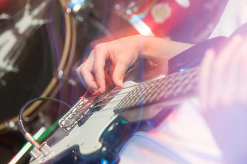 Fototapeta na wymiar aggressive play guitar on stage