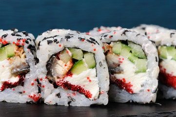 Set of square sushi rolls with vegs, cream cheese and red roe