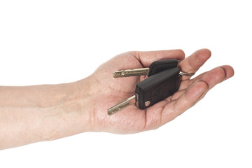 Hand with a car keys isolated on white background