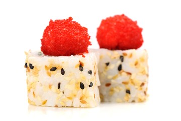 Yummy Japanese fusion rolls with sesame seeds topped with red roe
