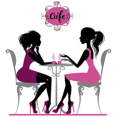 Two girls  in cafe