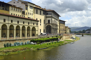 Fototapeta na wymiar Florence, Italy, crowd of tourists in front of the entrance to Uffici along the river Arno