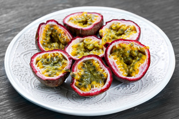 Ripe passion fruit on a wooden background