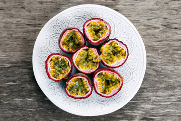 Ripe passion fruit on a wooden background