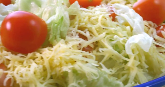 Beautiful colourful caesar salad with dressing croutons and parmesan cheese, healthy meal