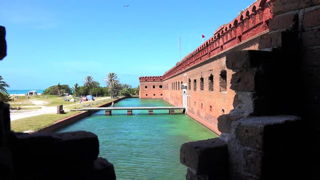 The crystal clear waters of the Gulf of Mexico surround Civil War Historic Fort Jefferson in the Dry Tortugas makes a great place for swimming and snorkeling. Amazing turquoise water color.