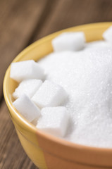 Fototapeta na wymiar Portion of white Sugar in a bowl