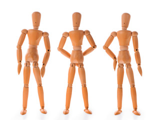 Three wooden dolls in different poses