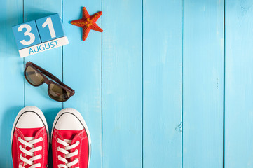 August 31th. Image of august 31 wooden color calendar on blue background. Last Summer day. Empty...