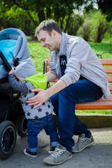 Toddler and father outside