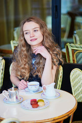 Beautiful Parisian woman in cafe
