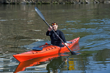 sports cheerful man in red kayak01