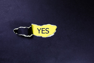 yes written under black torn paper.