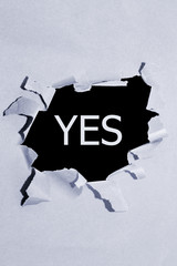 yes written under grey torn paper.