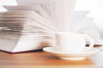 Book and ceramic coffee cup