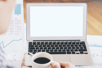 Office desk with white laptop