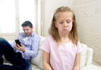internet addict father using mobile phone ignoring little sad daughter bored lonely and depressed
