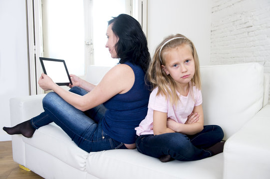 Internet Network Addict Mother Using Digital Tablet Pad Ignoring Little Sad Daughter Left Alone Bored