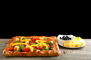 Freshly homemade pizza on black background