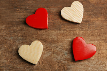 Naklejka na ściany i meble Wooden hearts on rustic wooden background