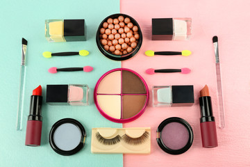 Makeup set with false eyelashes, brushes and cosmetics on bright background