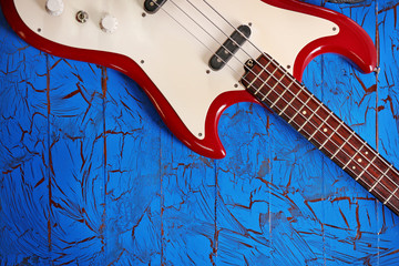 Electric guitar on blue wooden background