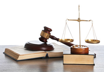Wooden gavel with justice scales and books on white background