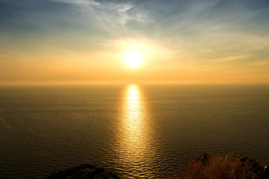 sunset mirror on sea to golden shadow
