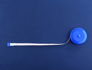 White measuring tape on a black background