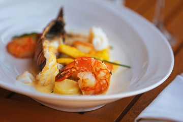 Seafood dish on a wooden table.